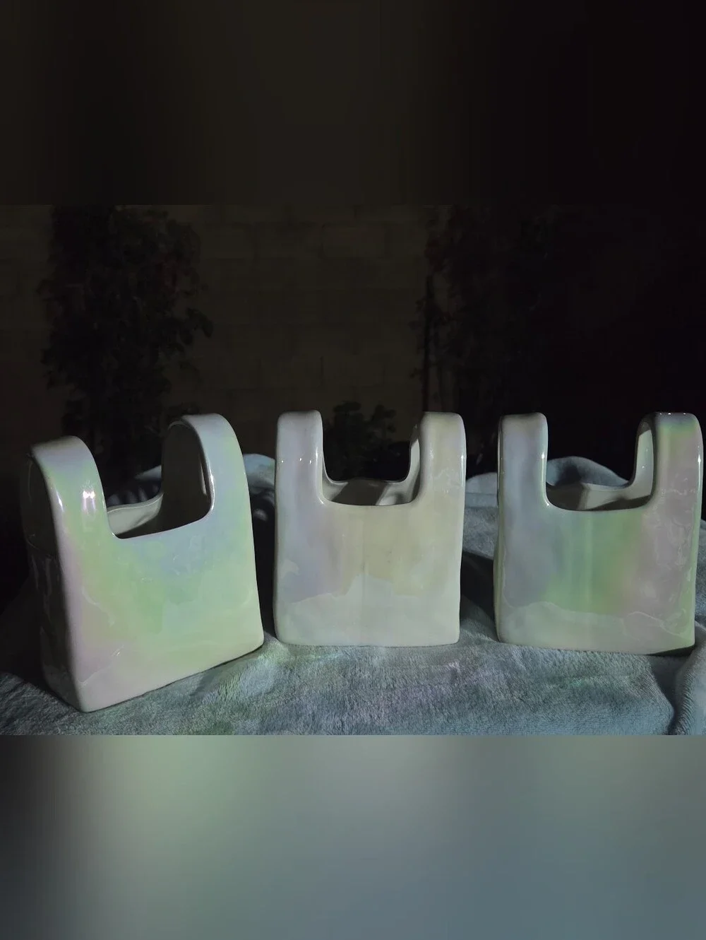 Iridescent ceramic purse vase. Spring 2025